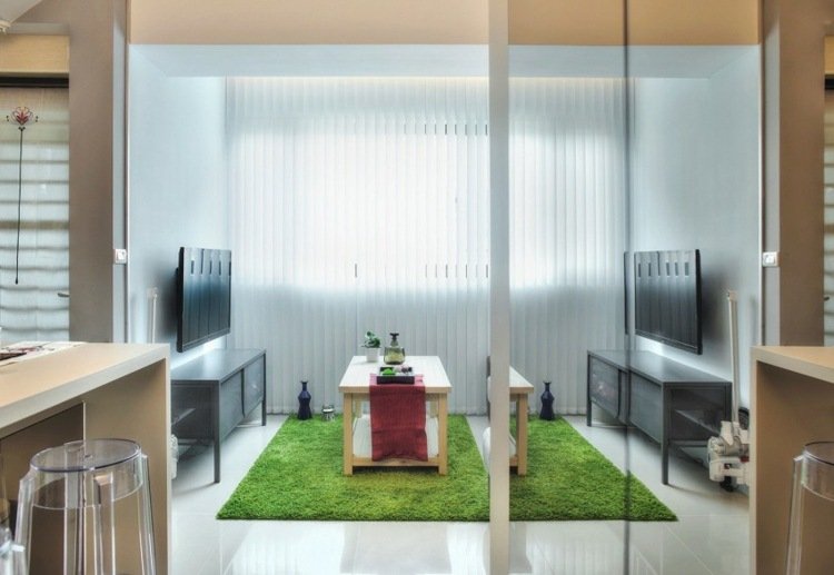 1 rums lägenhet inredning vardagsrum matta grönt skänk soffbord