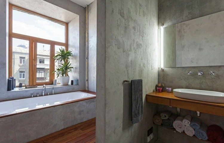 möblera 1 rums lägenhet betong badkar spegel handdukar fönster