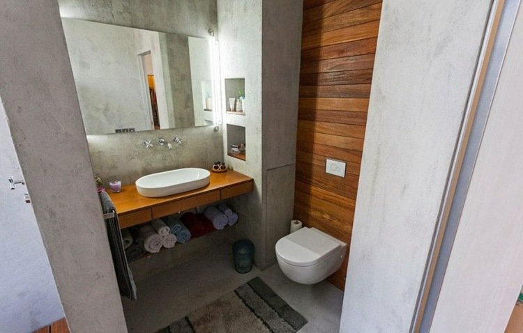 sätta upp 1 rums lägenhet betong badrum trä accent vägg badrum mattor