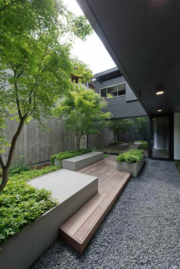 idéer för trädgårdsdesign modern-prydnadsgrus-grå-planter-markskydd-trädplantering