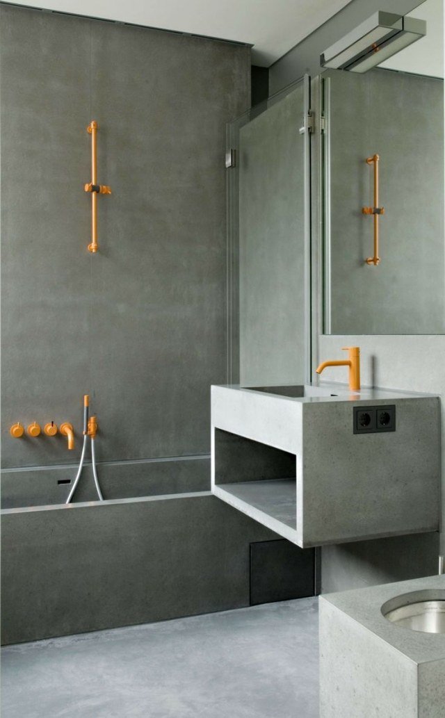 Betong-badrum-bilder-moderna-rektangulära-former-beslag-handdukstorkar-ljus-orange