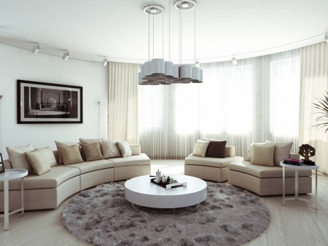 inredning vardagsrum rund soffa rund matta soffbord design modern högglans