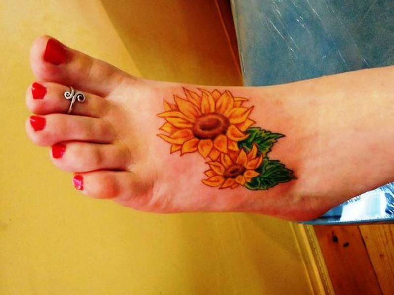 Auringonkukka -tatuointimallit merkityksineen