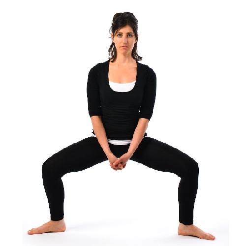 Το Squat and Rise Yoga Pose