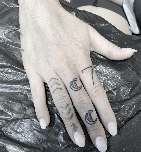 C Letter Tattoo Design On the Middle Finger