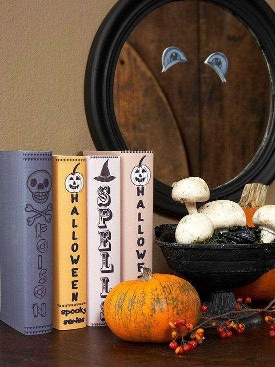 halloween dekor idéer mantelpiece böcker klä upp ögon spegel papper