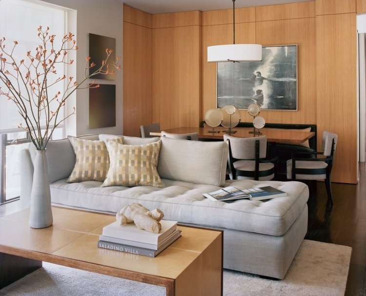 modernt-vardagsrum-neutral-färger-grå-trä-väggpanel-matbord-elegant