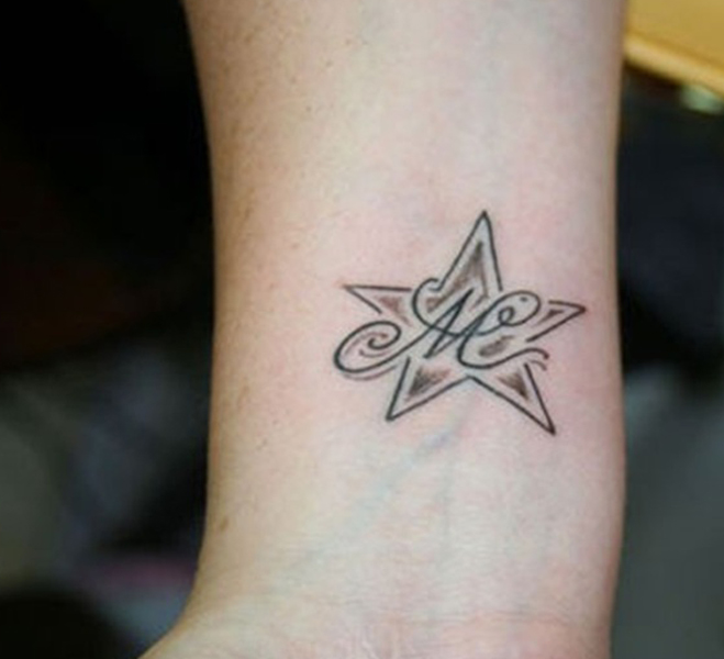 M Letter Tattoo Design In Star Shape