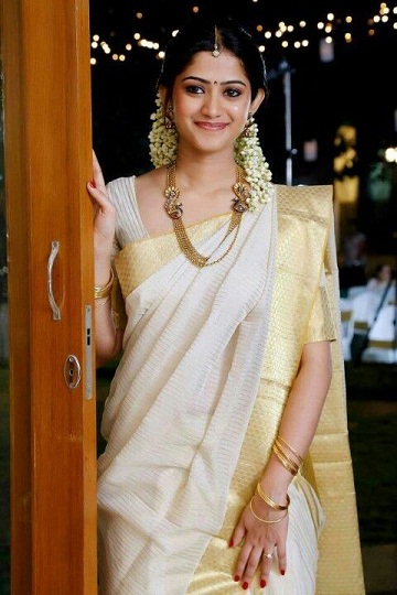 The White With Gold Border Saree