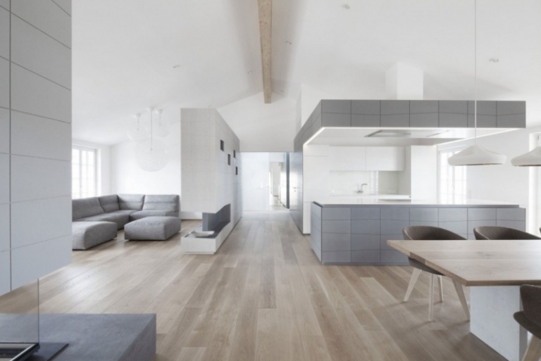 Moderna levnadsidéer -grått-minimalistiskt-vardagsrum-öppet-kök-vitt trägolv