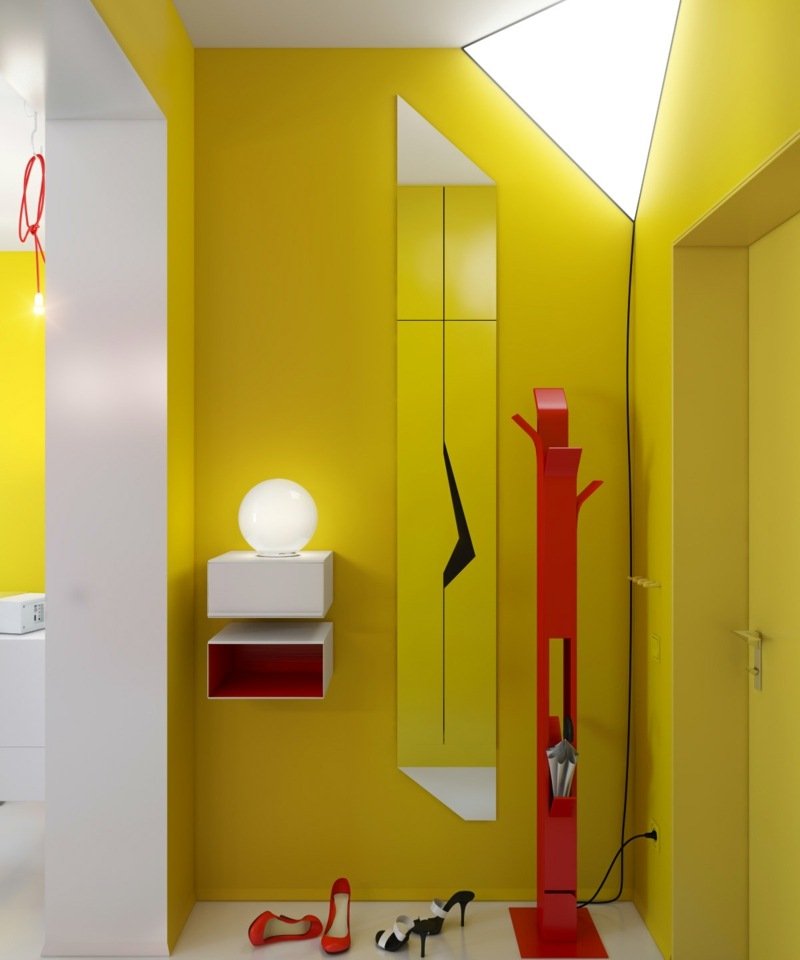 levande idéer för korridoren gul väggdesign röda accenter spegel