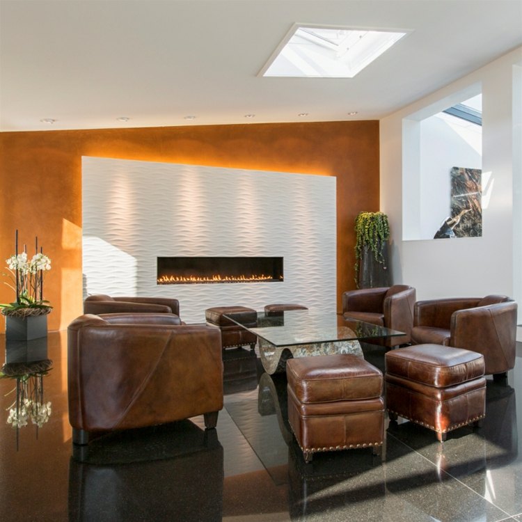 3D-vägg-design-sten-lounge-natursten-platta-ljus-dekorativ-fåtölj-äkta-läder-glas-bord