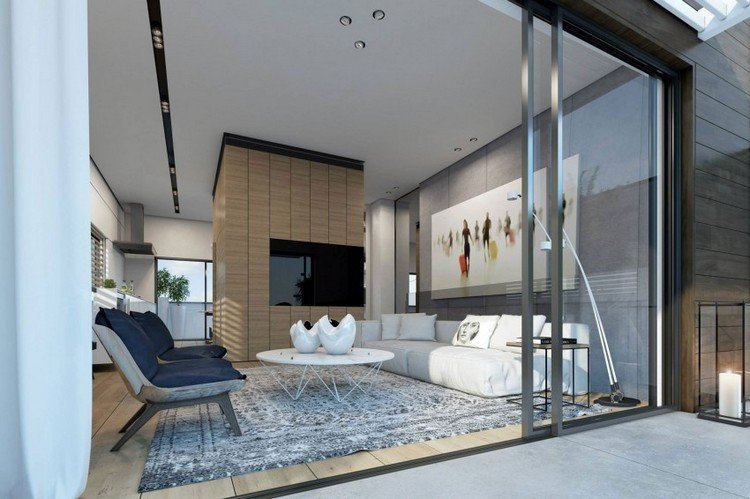 design-vardagsrum-vit-soffa-runt-soffbord-grå-matta-fåtölj-platt-TV