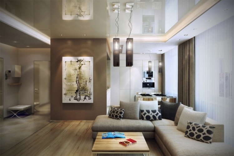 möbleringsidéer-vardagsrum-brun-beige-hörnsoffa-kudde-mönster-soffbord-hängande lampa-bild-tak-högglans-modernt-fönster