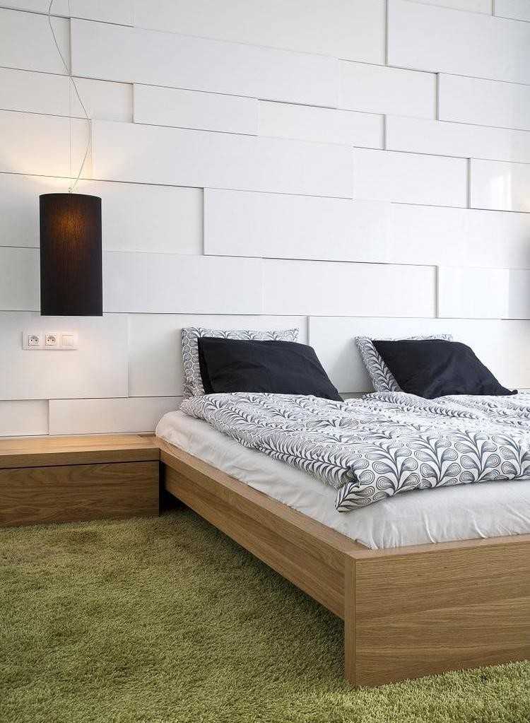 heminredning-idéer-sovrum-väggpaneler-vit-3d-trä-säng-grön-matta