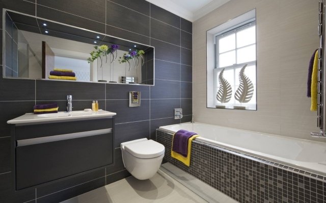 svart-grå-badrum-minimalistisk-rektangulära-kakel-storformat-porslin stengods
