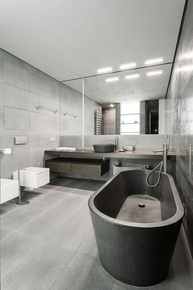 industri-chic-inredning-badrum-väggar-grå-betong-kakel-badkar
