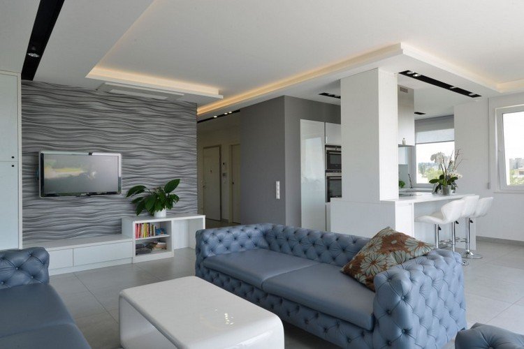 Moderna inredningsidéer-vardagsrum-grå-3d-väggpaneler-vågor-indirekt-takbelysning