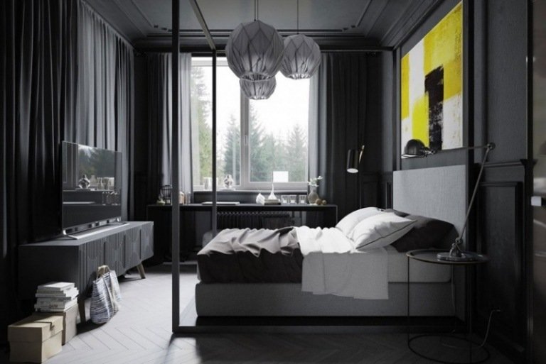 svart-sovrum-man-grå-stoppad-säng-gul-konstverk-vägg