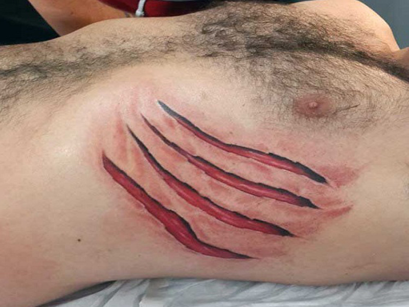 Ιδέες, σχέδια και εικόνες Ripped Skin Tattoo