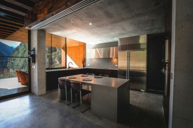 Kök-bord-gjord av granit-betong-vägg-mörkare-utrustning