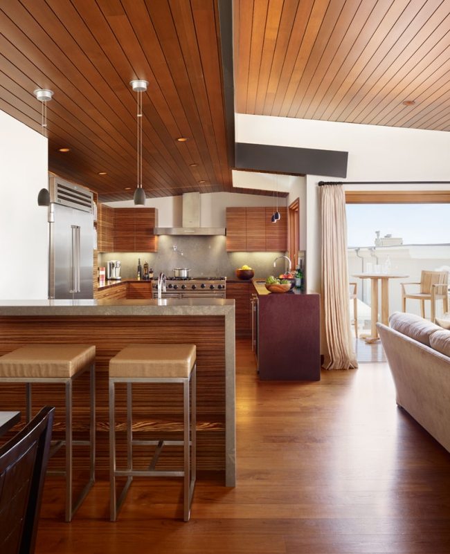 Upphängt trätak kök vardagsrum träfronter rostfritt stål