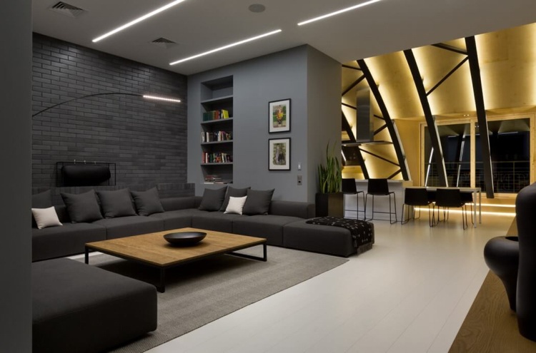 Antracitfärg -moderna-vindsrum-lägenhet-vardagsrum-pffen-kök-soffa-tegel