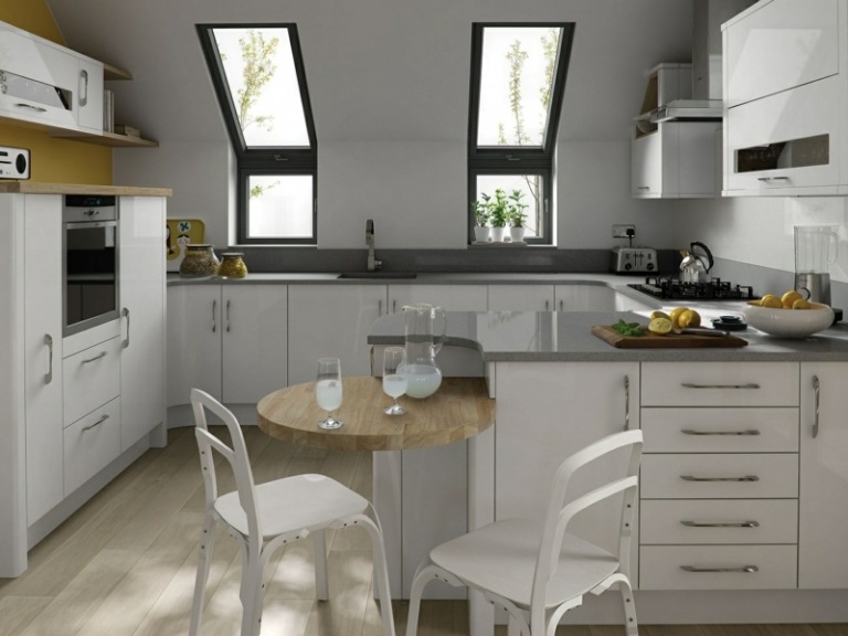 bänkskiva betong utseende kök sluttande tak moderna skåp vita
