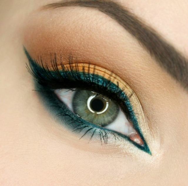 Betona ögonen Applicera liseshadow nyans av gröna och gula ögonfransar