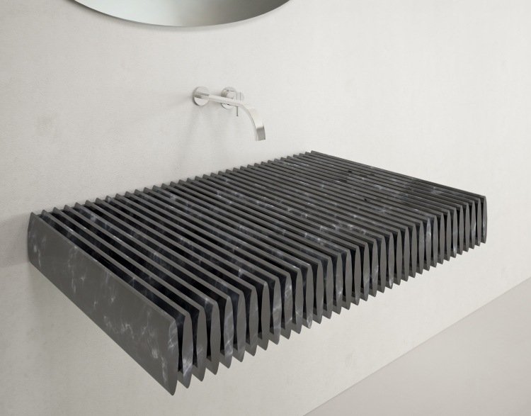 tvättställ-badrum-design-innovativ-svart-räfflad-granit-kran