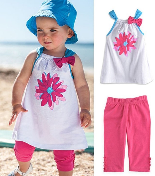 bebiskläder-tjej-rosa-byxor-vit-tunika-blomma
