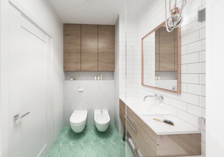 Badrum i vitt och trä designat med mönstrade golvplattor i mintgrönt