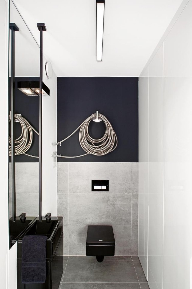 badrum-modern-inredning-radiator-design-intressant-form-svart-badrum-möbler