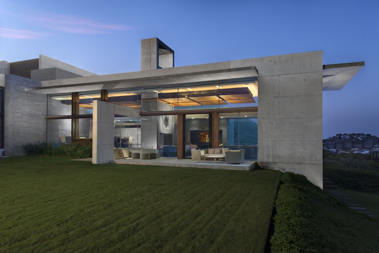 bauhaus-stil-hus-granit-betong-arkitektur. naturlig-gräsmatta