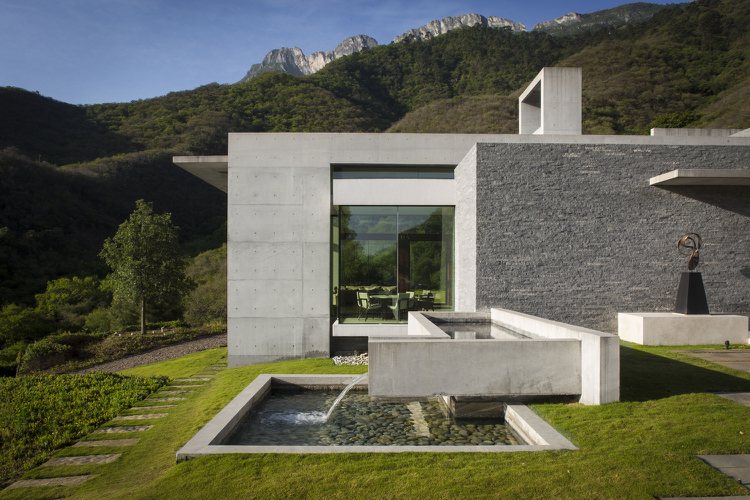 bauhaus-stil-hus-granit-betong-vattenkaskad-utomhus-trädgård