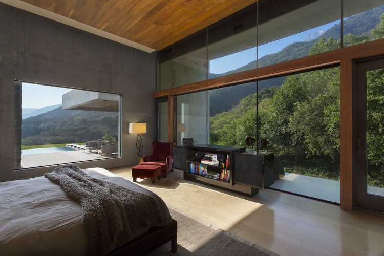 hus i bauhaus-stil-granit-betong-sovrum-utsikt-glas