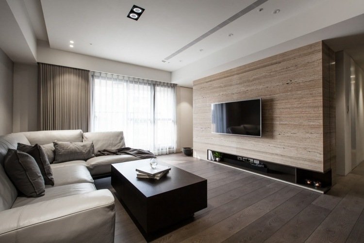 beige-färg-vardagsrum-hörn-soffa-läder-travertin-väggbeklädnad-modern-inredning-design