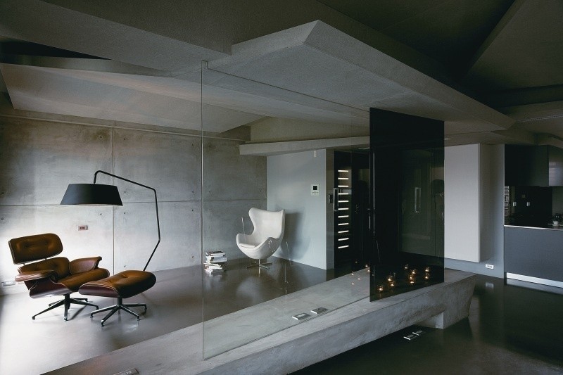 betong-design-modern-rum-avdelare-glas-vägg-fåtölj-läsning hörn-eames-lounge-stol-ägg-svart-grå