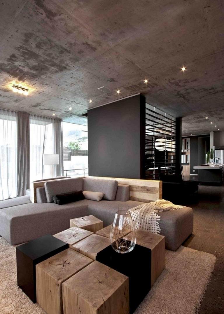 betong-design-modernt-vardagsrum-betong-tak-hörn soffa-brun-fläckar-träelement-soffbord-träblock