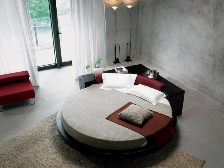 betong-design-moderna-sovrum-säng-runda-svart-röda-fönster-terrass-dörrar