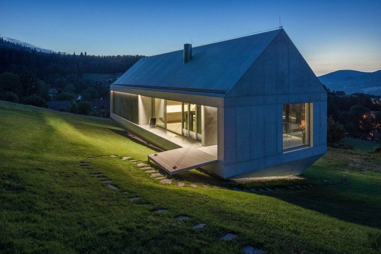 betong-design-inuti-utanför-betong-hus-belysning-gräsmatta