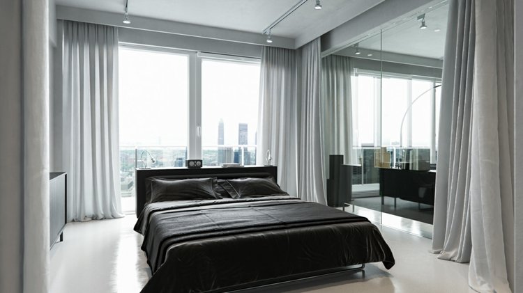 betong-färg-sovrum-vitt-golv-svart-säng-grå-gardiner