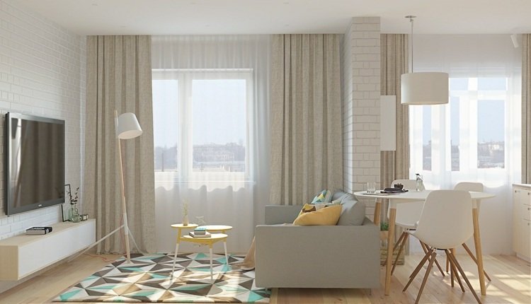 Sängen i vardagsrummet integrerar ett matta-geometriskt-mönster-färg-matbord