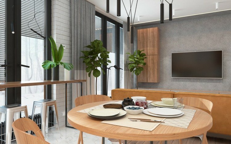 säng-vardagsrum-integrera-runt-matbord-trä-ljus-växter-dekoration