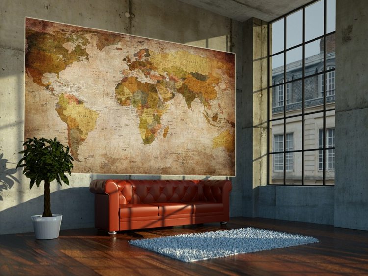betongvägg vardagsrum läder soffa världskarta storformat