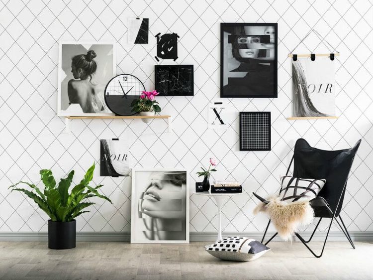 Bildvägg design svartvita foton hyllor hänga upp golvfåtöljer skandinaviska