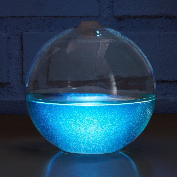 sfäriskt bioluminescensakvarium med förökande bakterier
