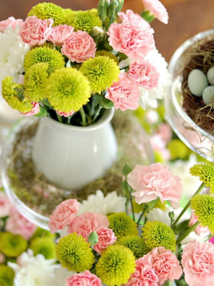 nejlikor blomsterarrangemang rosa vas ägg grönt