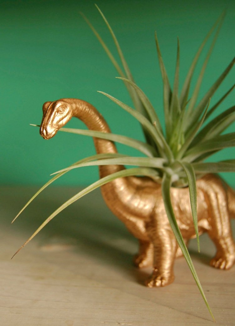 dinosaurie dekoration guld blomkruka idé graeser interiör