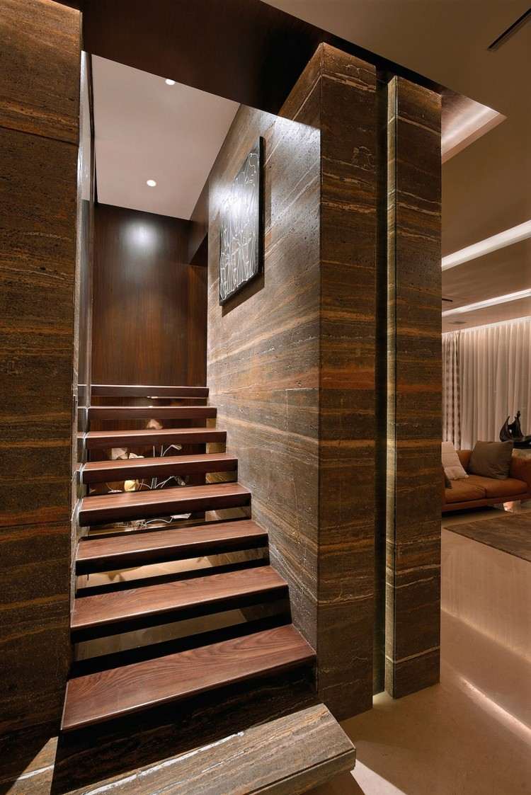 brun-toner-lägenhet-flytande-trappor-sten-pelare-strukturerad-yta